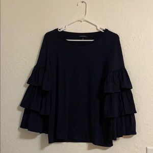 Long ruffle/bell sleeved, navy blue blouse.